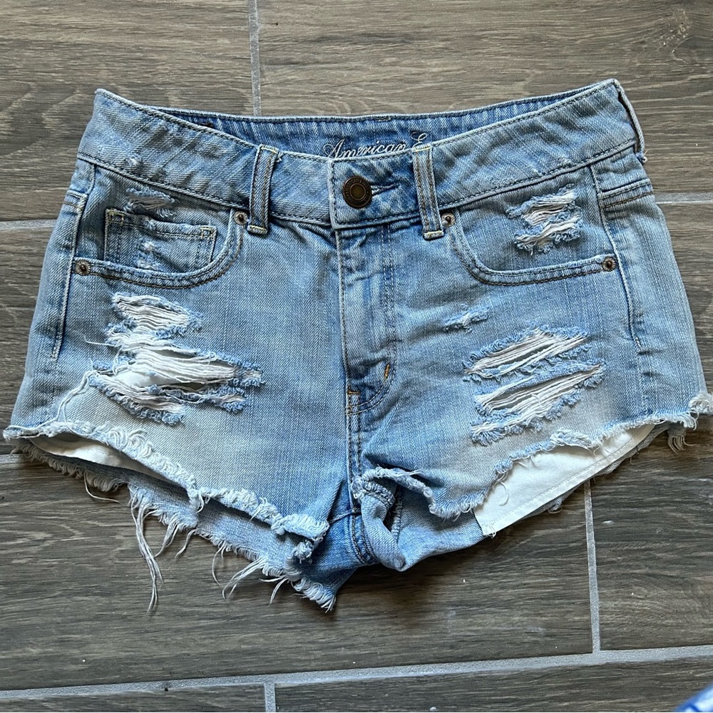 light washed ripped jean shorts by american eagle outfitters